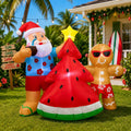 Hawaiian Santa beside a watermelon Christmas tree and a gingerbread man in sunglasses inflatable