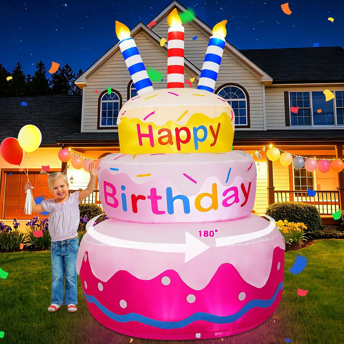 Pink and yellow three-tier Happy Birthday cake inflatable with candles and a girl beside it
